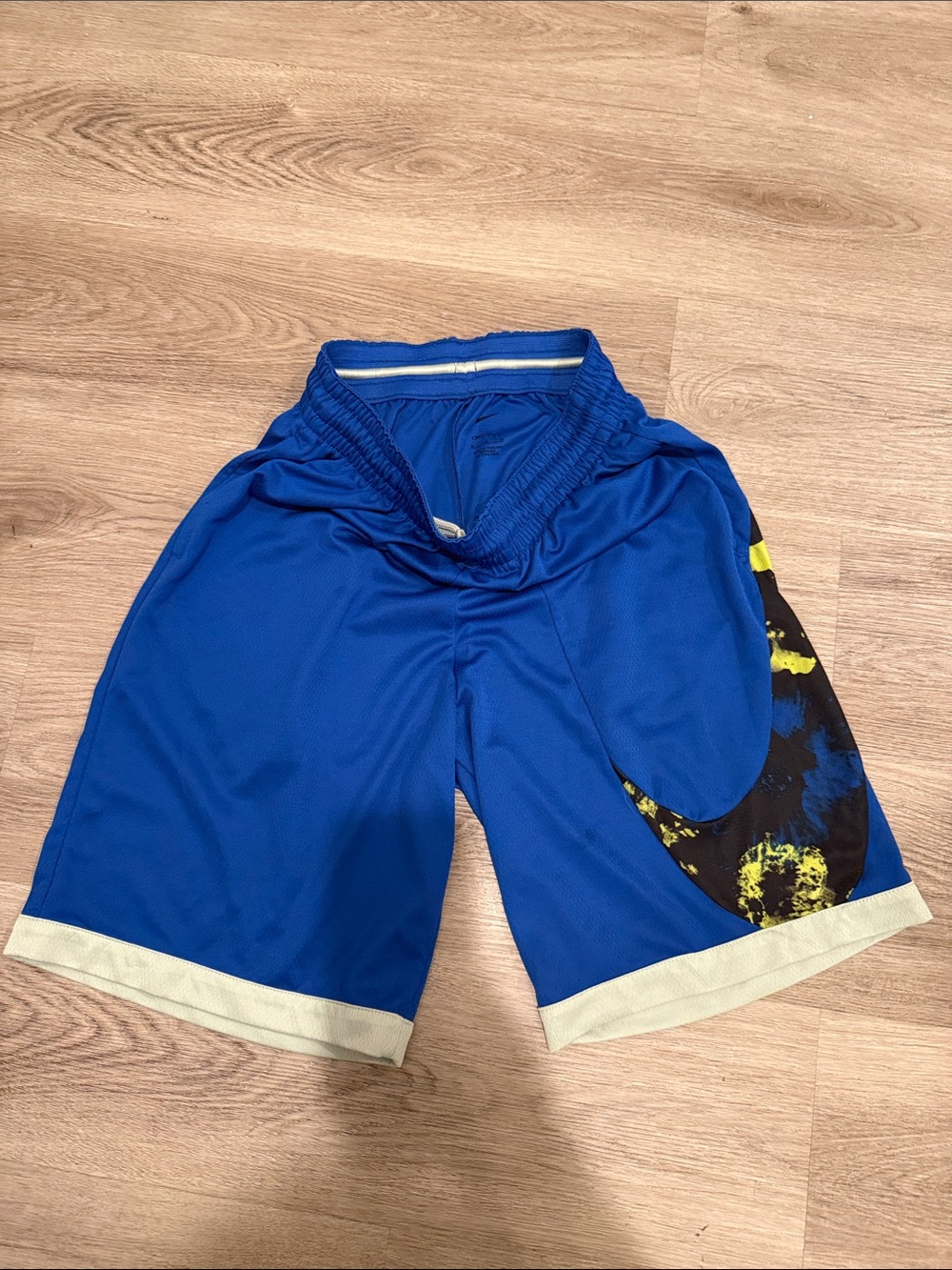 Nike Blue Athletic Shorts with Black Swoosh and Yellow Accent